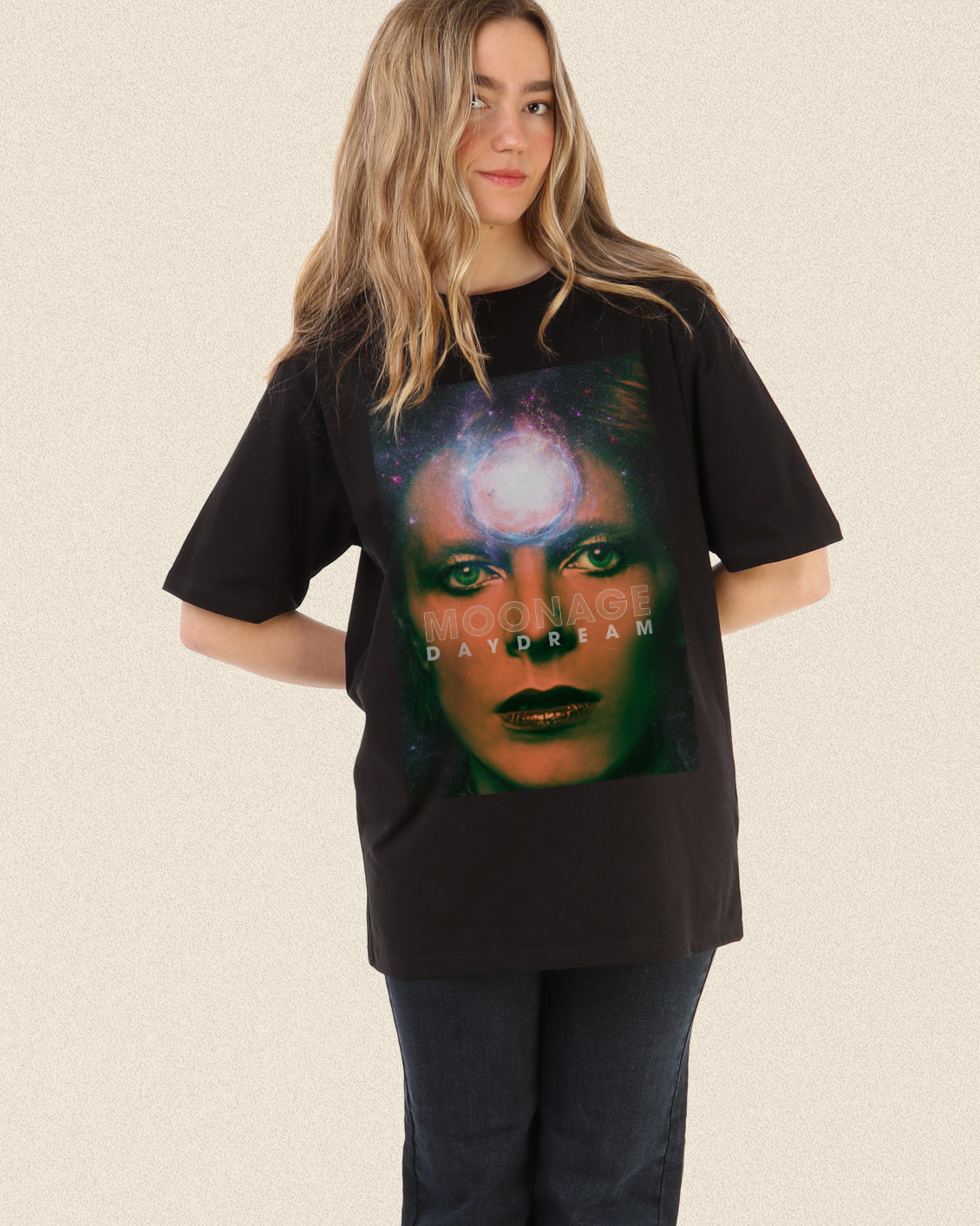 Black tee with a vintage David Bowie Moonage graphic of his face close up