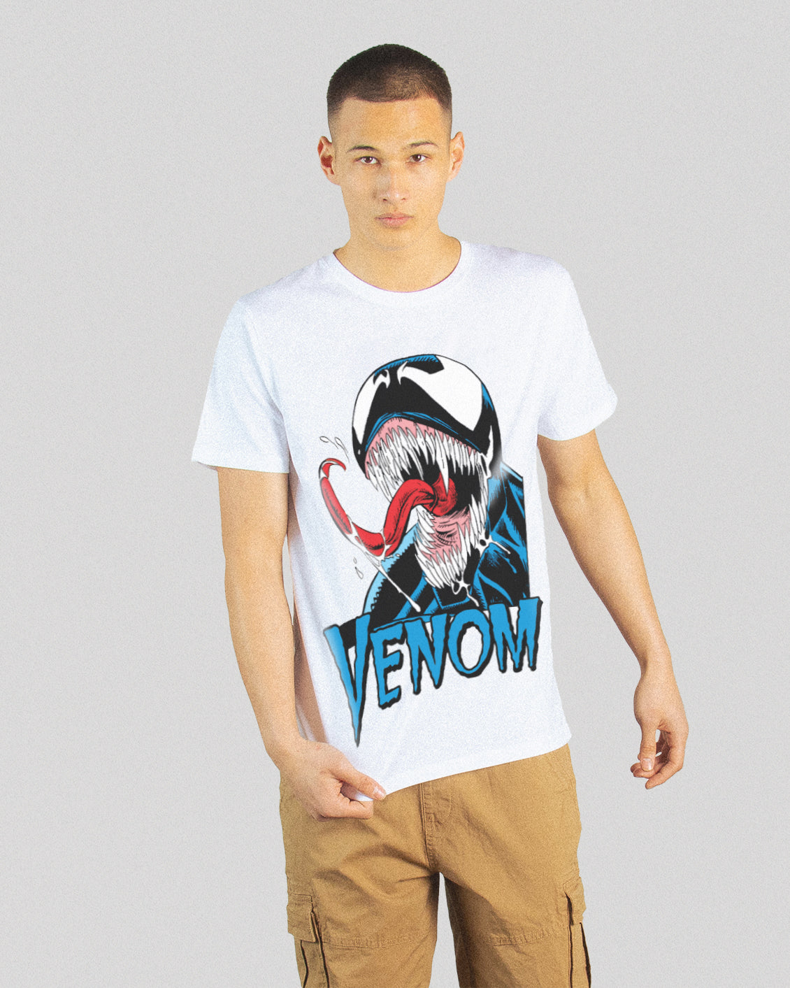 venom monster on a white tee, while the model is pulling the tee down