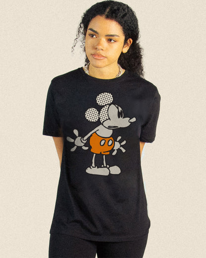 Model wearing MICKEY MOUSE POSE DROP graphic on a black SHOULDER TEE 