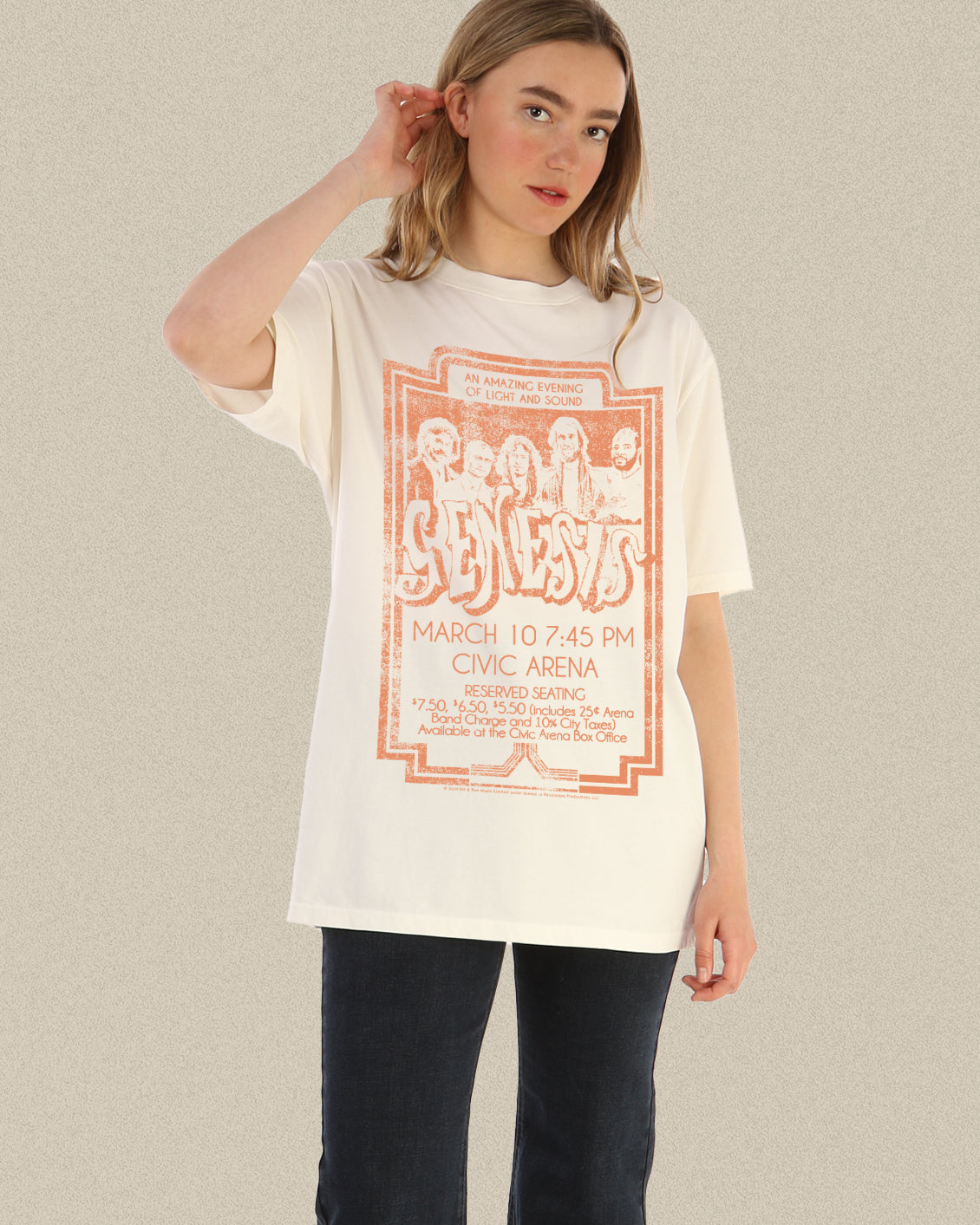 model wearing a vintage light sand coloured tee of genesis graphic in orange